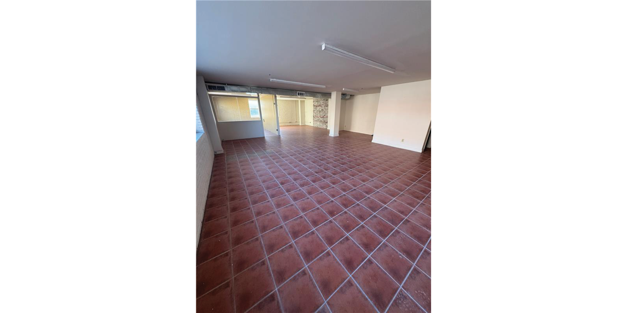 5 Adrian Avenue Interior Open Retail Area with brown tile flooring
