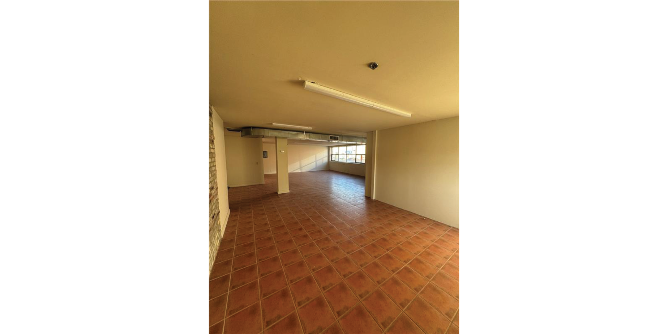 5 Adrian Avenue Interior Open Retail Area with brown tile flooring