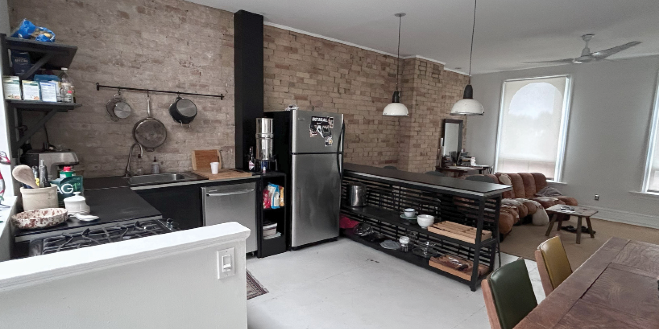 781 Queen Street E Apartment Area with Kitchen & Living Room Area with sofa