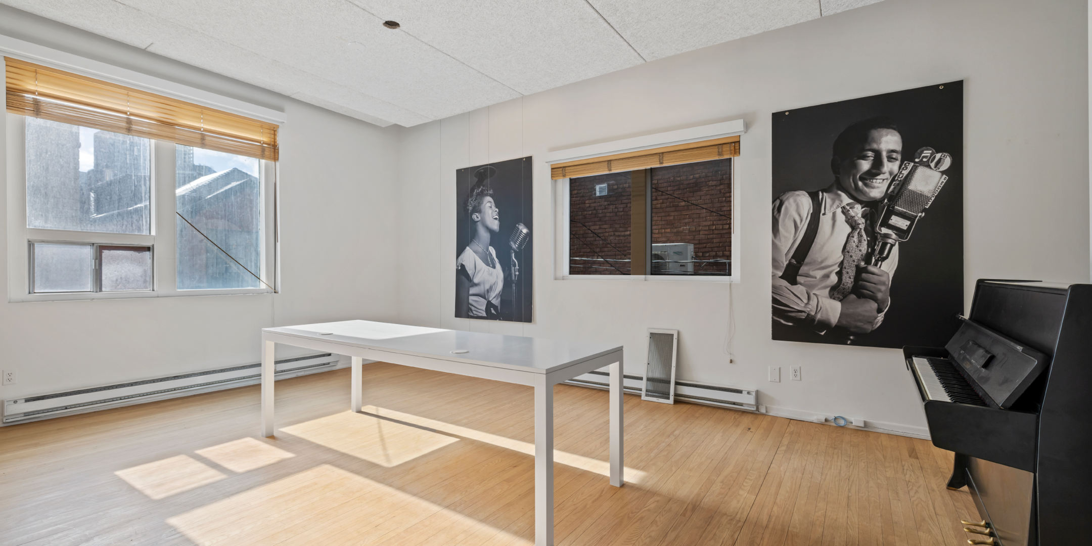 1058 Yonge interior space with piano and painting on the wall
