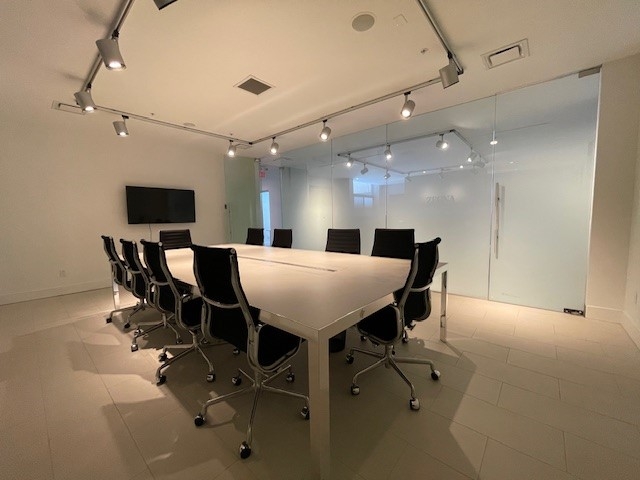160 Pears Avenue boardroom with glass window and TV