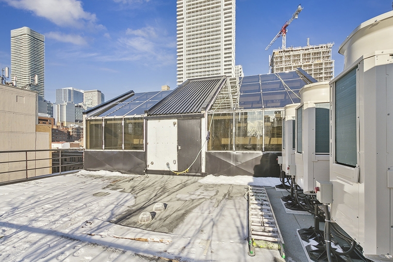 101 Richmond St E rooftop view with a mix of modern high-rise buildings in the background