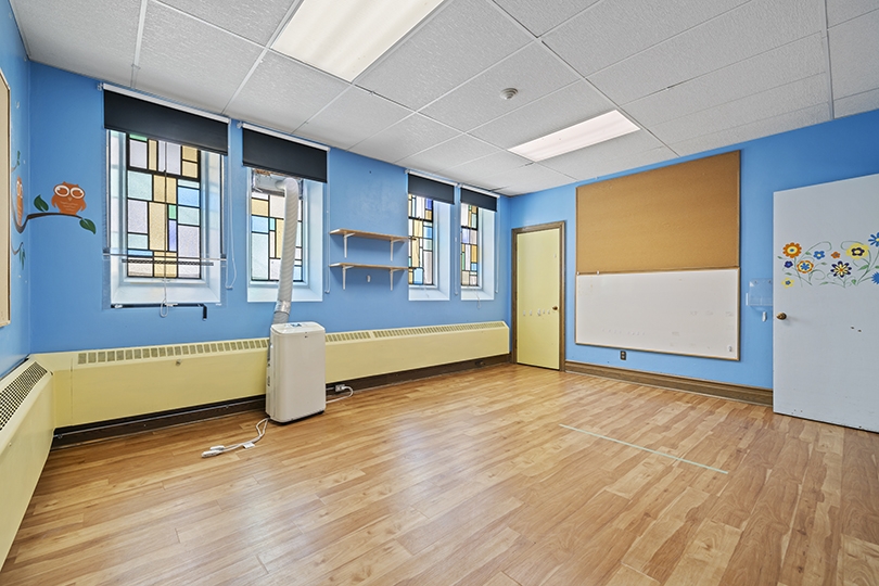 1847 Bayview Ave interior view of the classroom with blue walls 