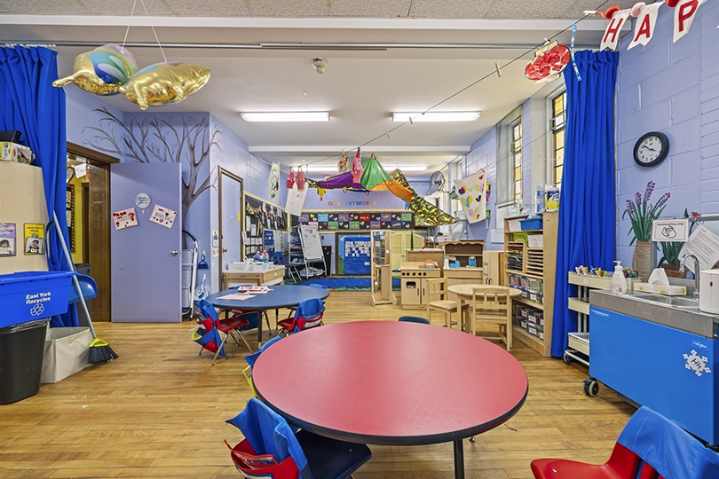 1847 Bayview Ave interior view of the classroom colorful tables and chairs
