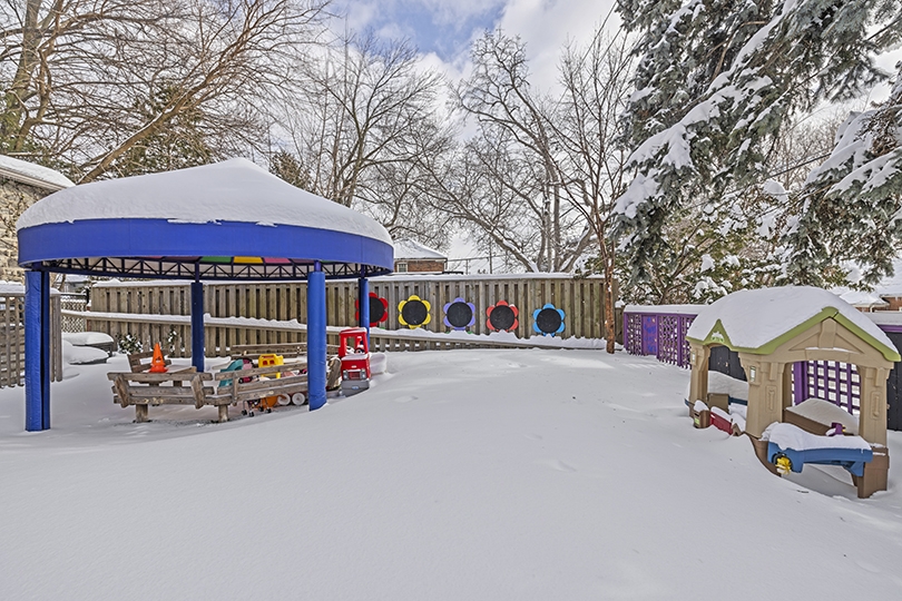 1847 Bayview Ave exterior view of the playground area covered with snow