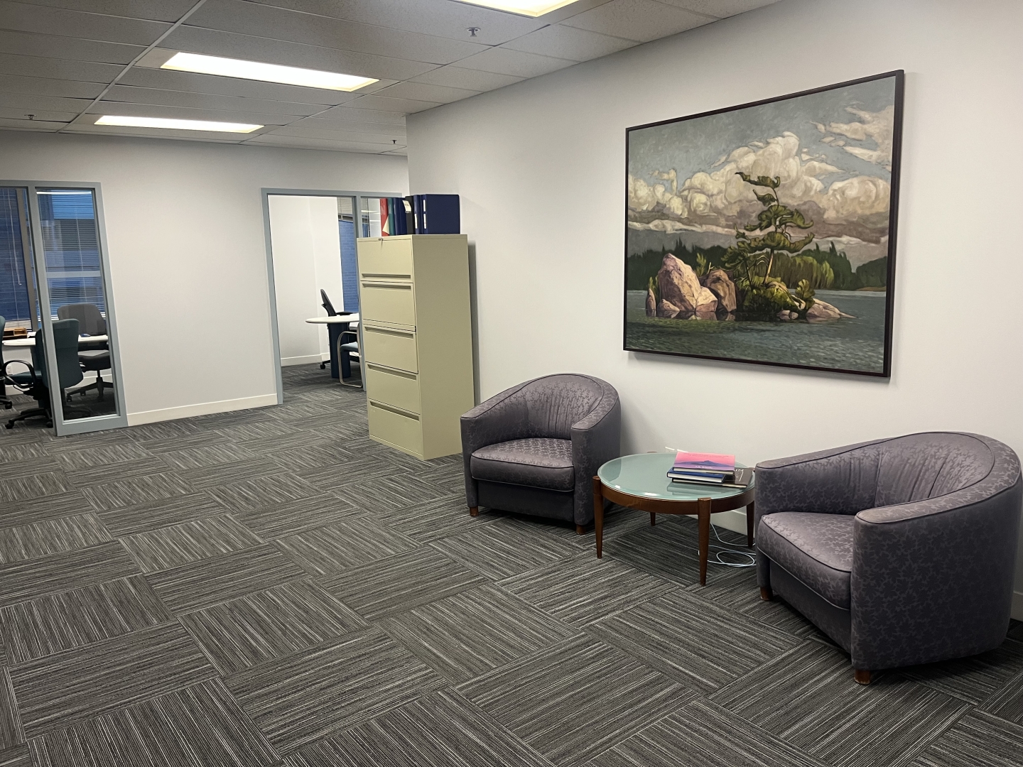 184 Front Street E reception area with a hugh picture and two sofa chairs