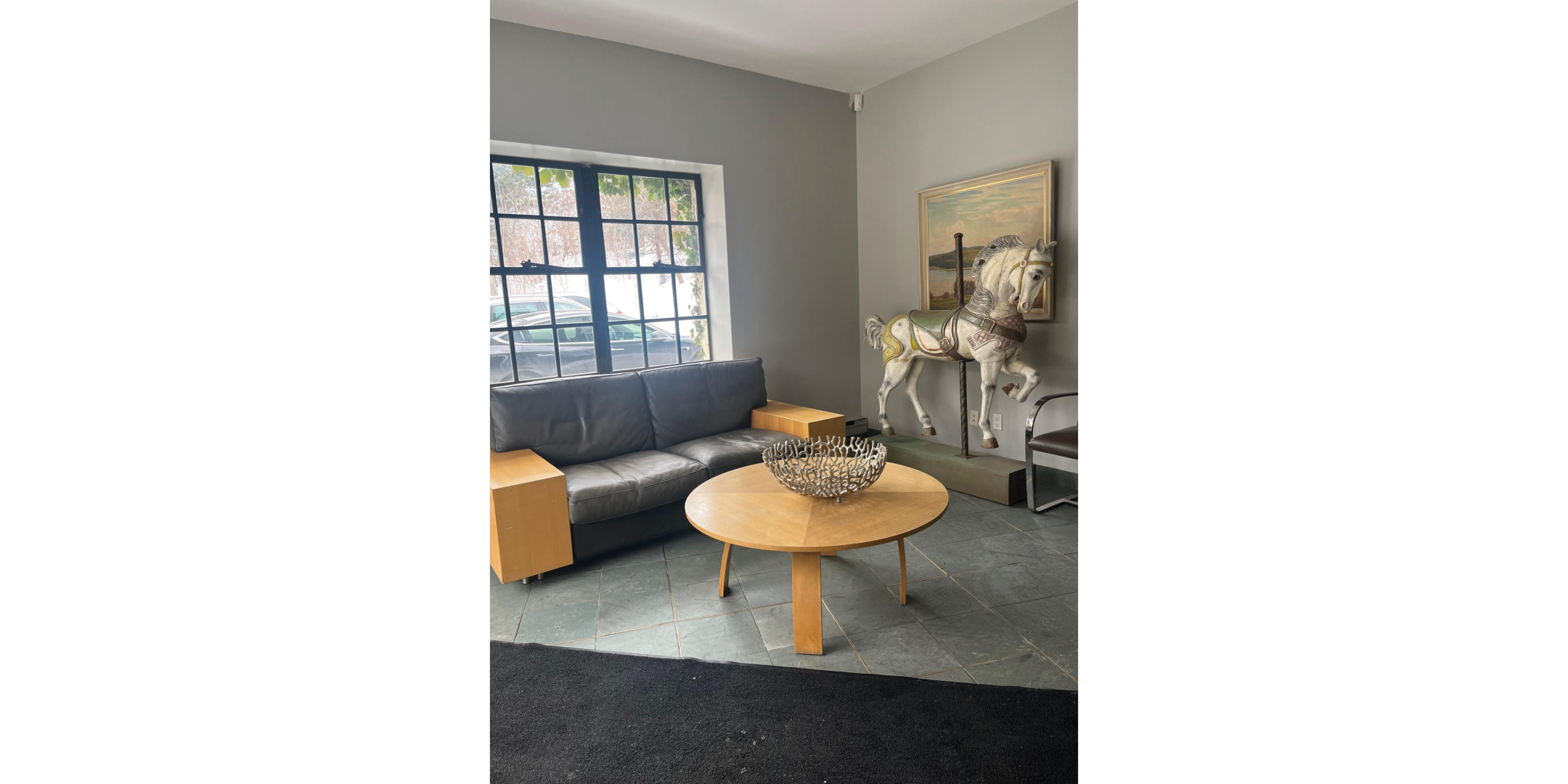 225 Macpherson Avenue interior space with sofa and big window