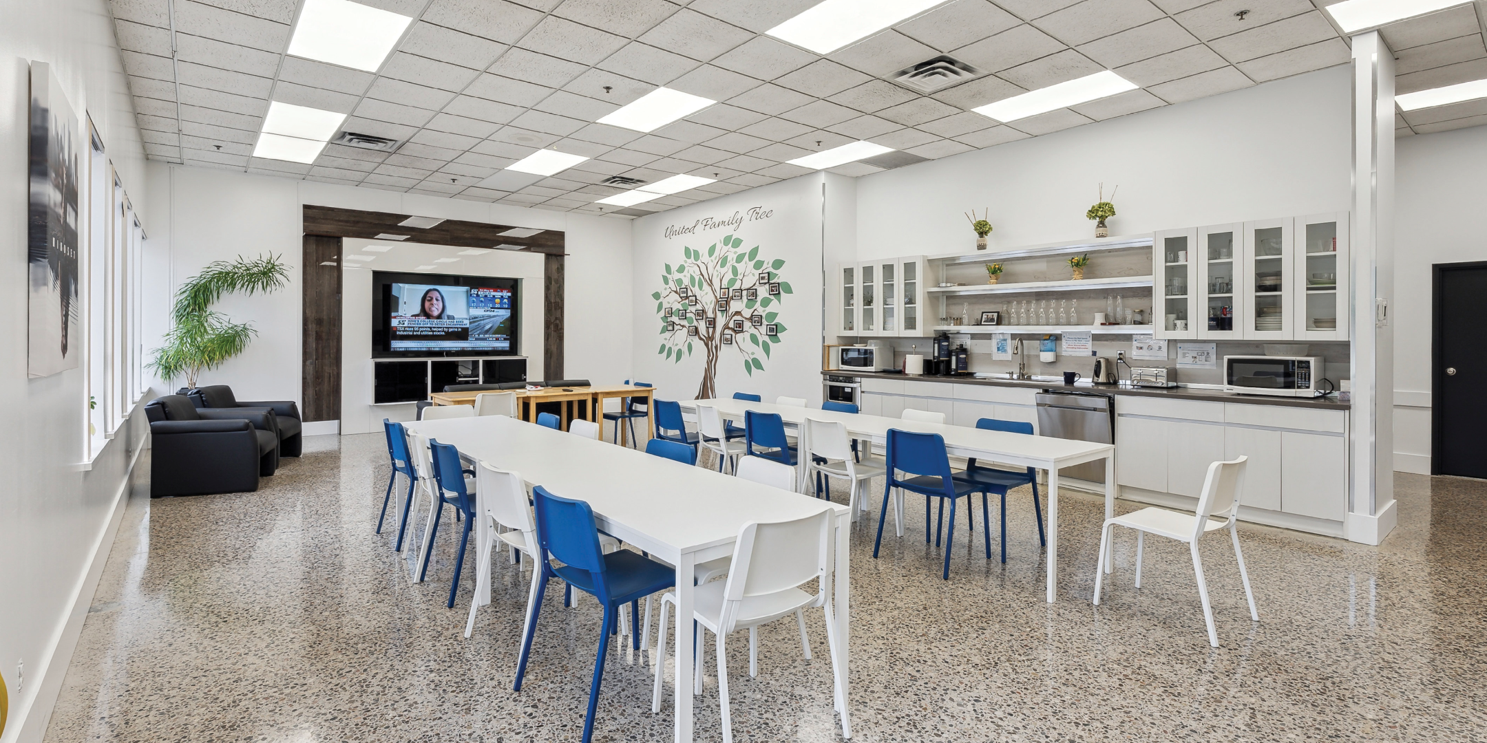 46 Hedgedale Road Lunch Room with TV, large table, chairs and kitchenette