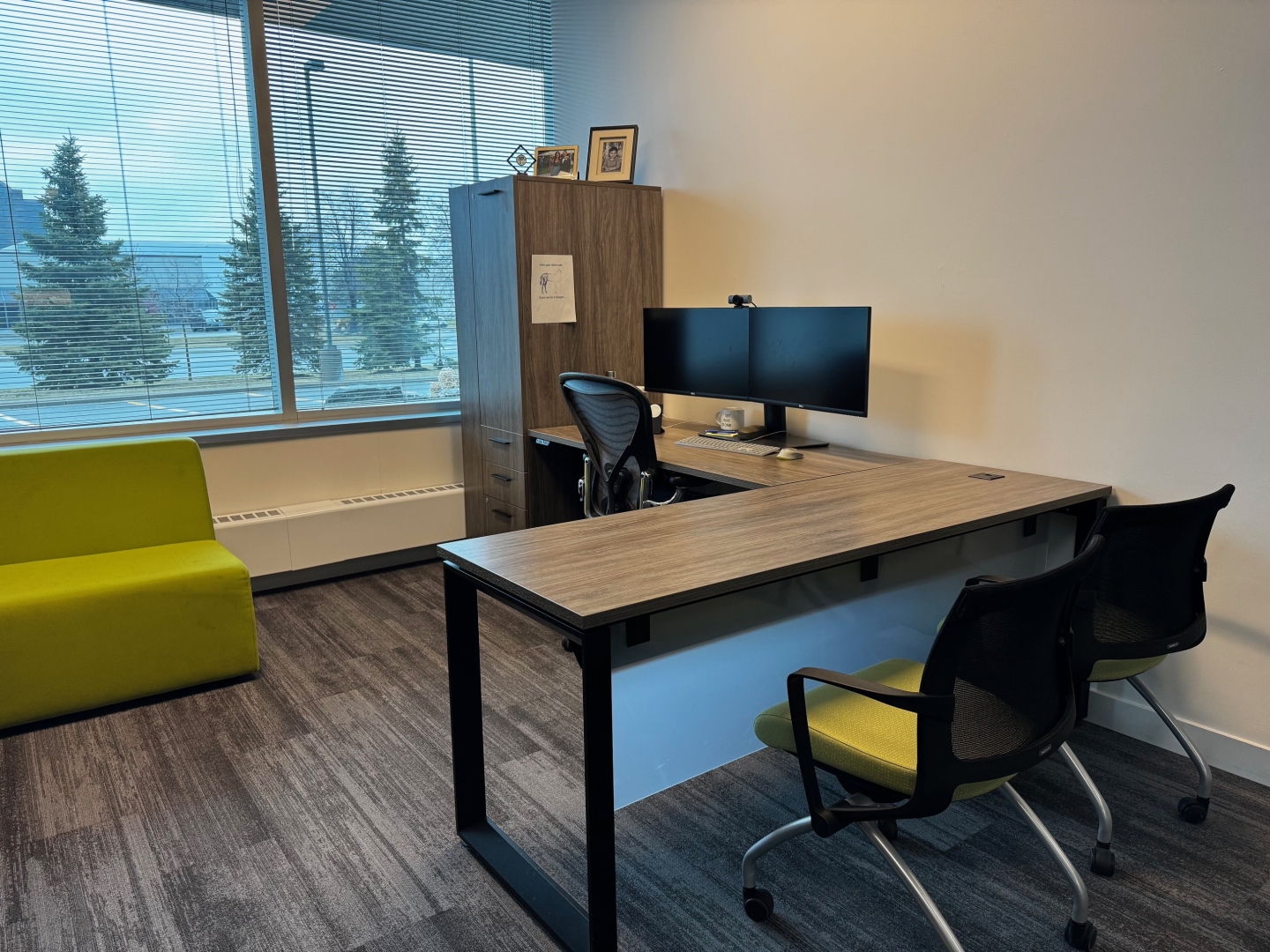 2680 Matheson Blvd E private office with a green sofa, cabinet and L-shaped office desk