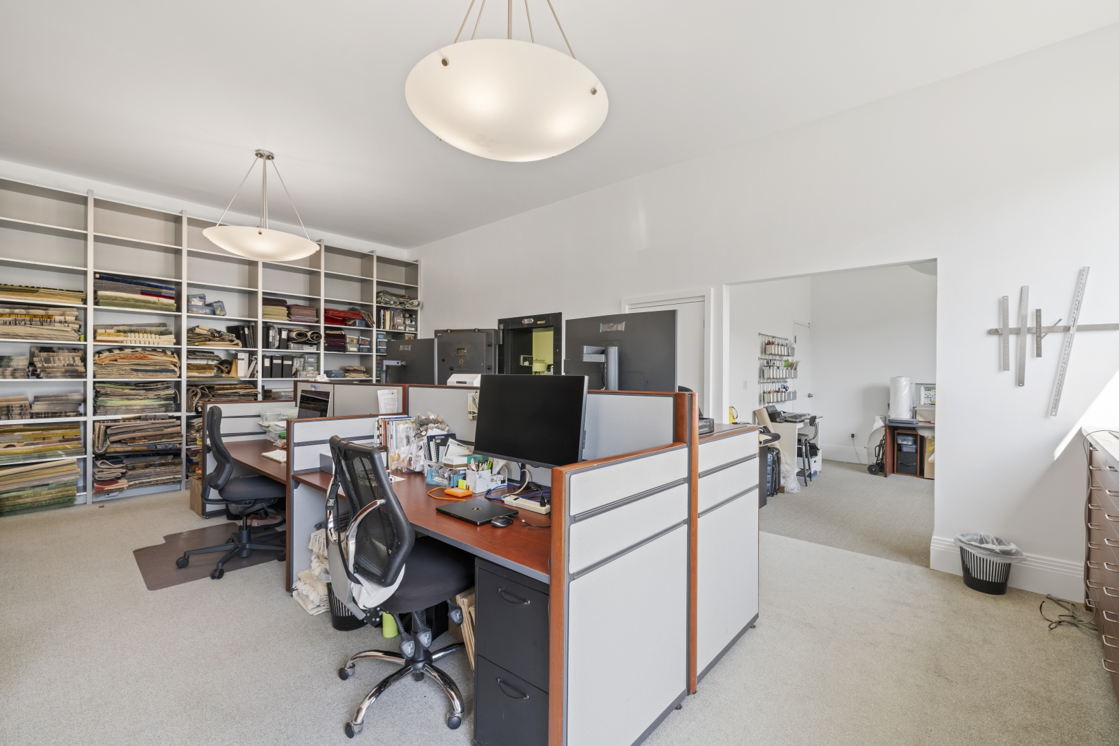 532 Annette Street Ground Floor office area with desks, chairs and shelves