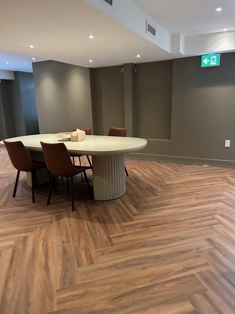 111 Yorkville Avenue lower level office with big table and chairs
