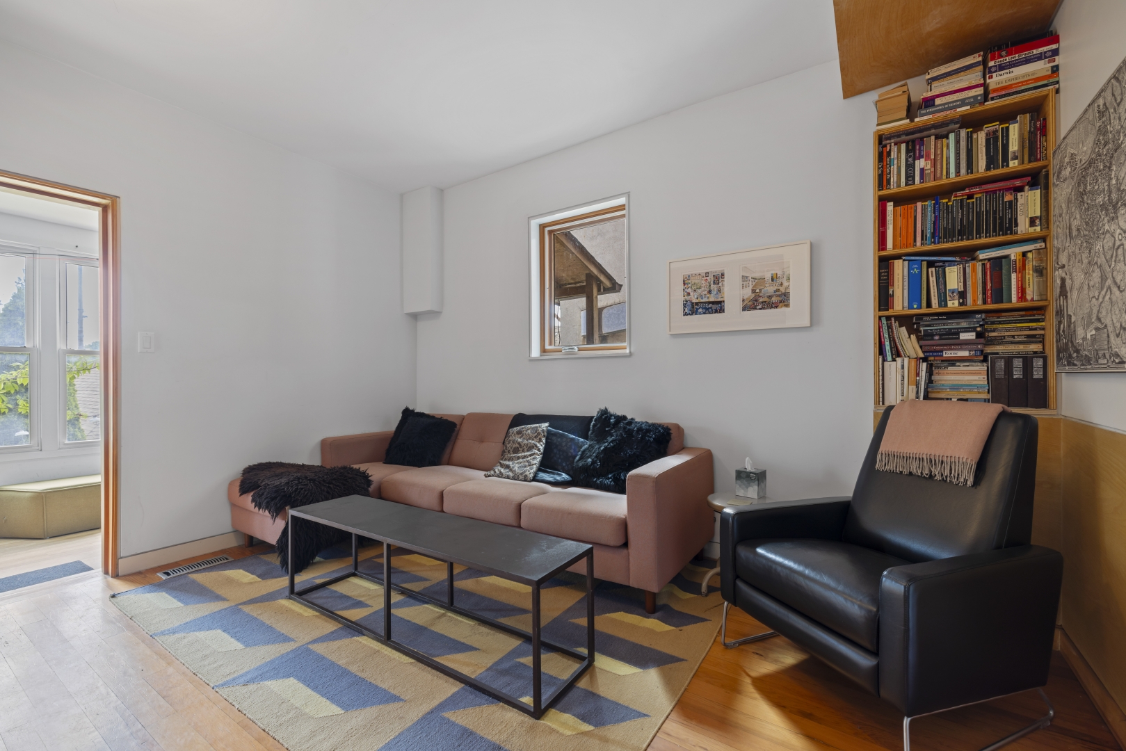 1157 Davenport Road livingroom with bookshelf overlooking the sofas