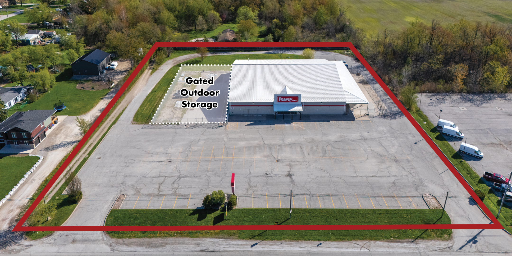 Aerial of Former Peavey Mart Store in Essex with property outlined in blue with Outside storage highlighted