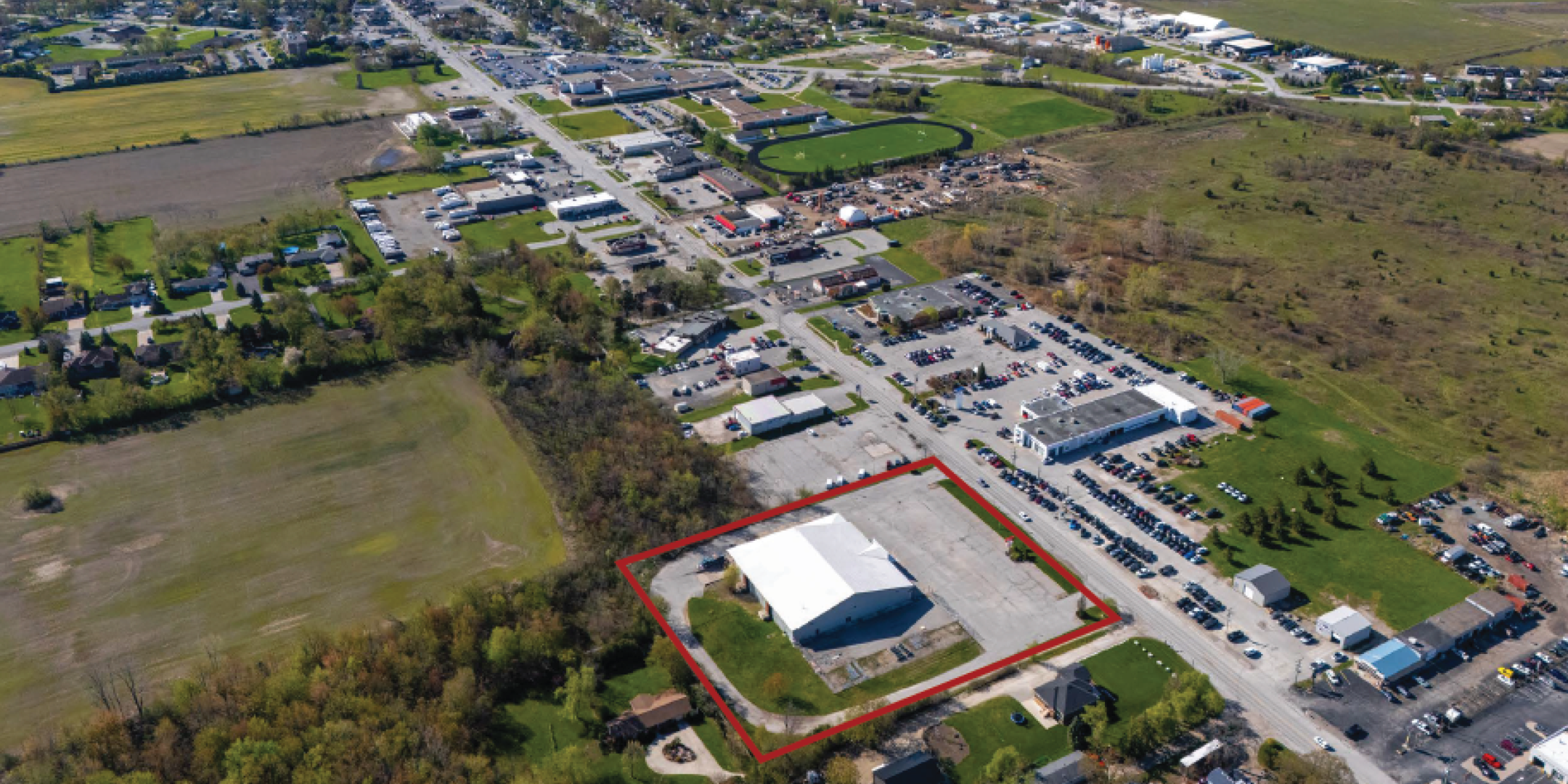 Aerial of Former Peavey Mart Store in Essex looking south showing Essex buildings in the background