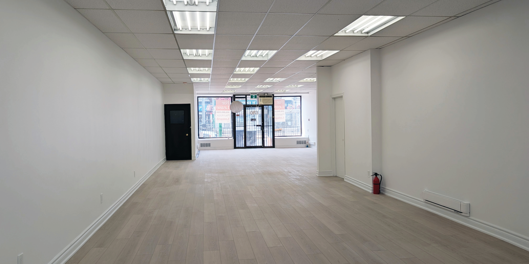 1710 St. Clair Avenue W Interior Facing Front Entrance with Large glass doors