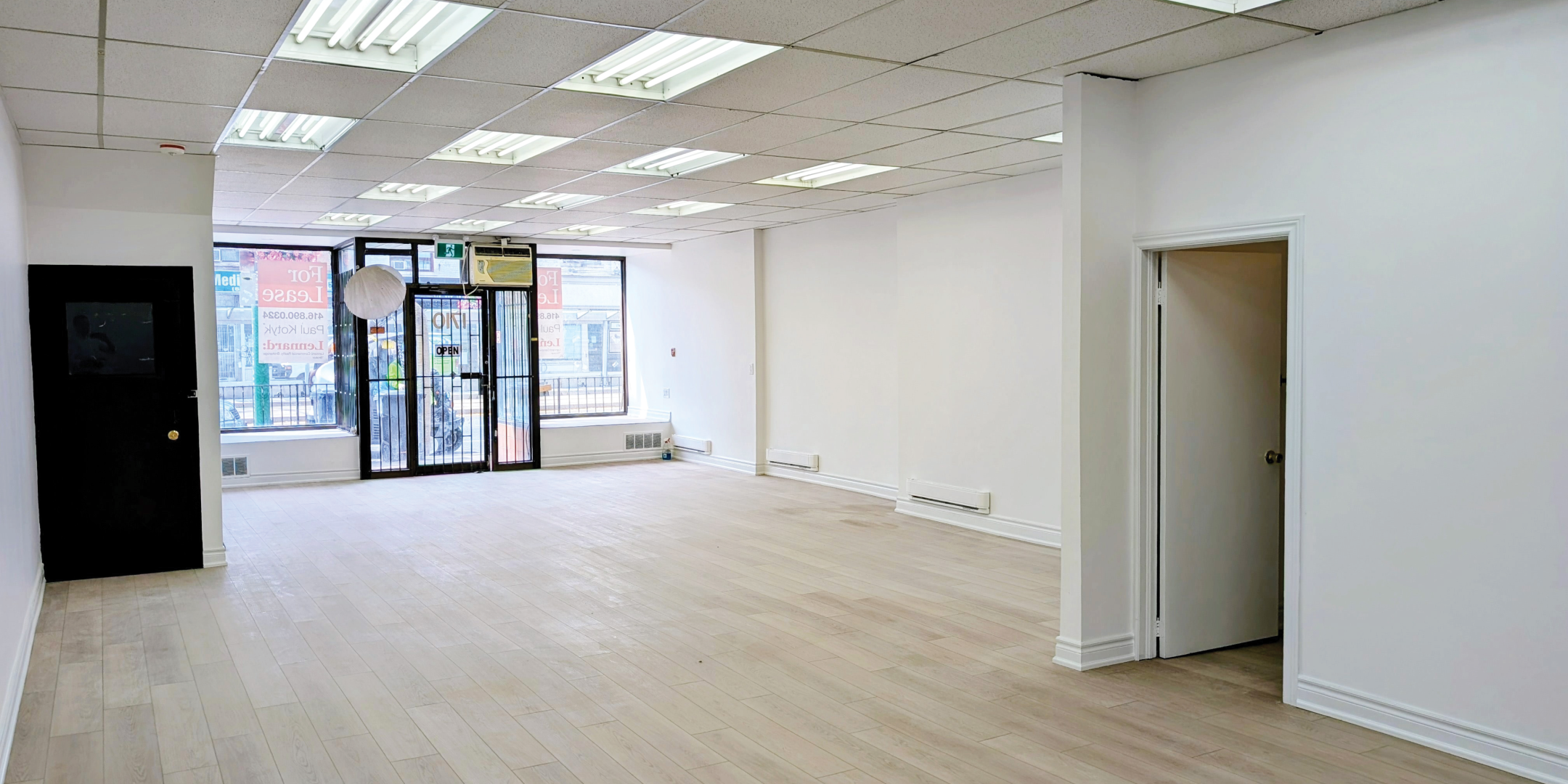 1710 St. Clair Avenue W Interior Facing Front Entrance with Large glass doors