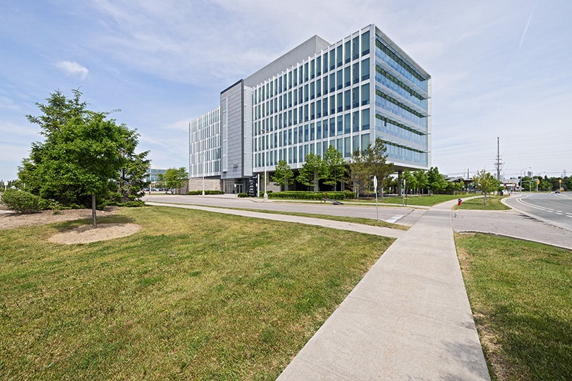 5015 Spectrum Way exterior view of the whole building and trees around