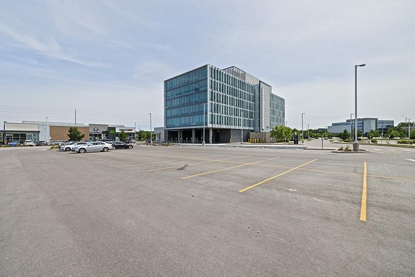 5015 Spectrum Way exterior view of the whole building and parking area
