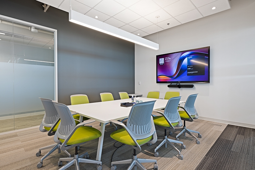 5015 Spectrum Way interior view of conference room features a sleek white table