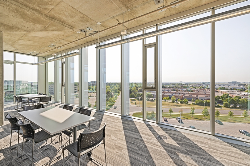 5015 Spectrum Way interior view of corner lounge with floor-to-ceiling windows