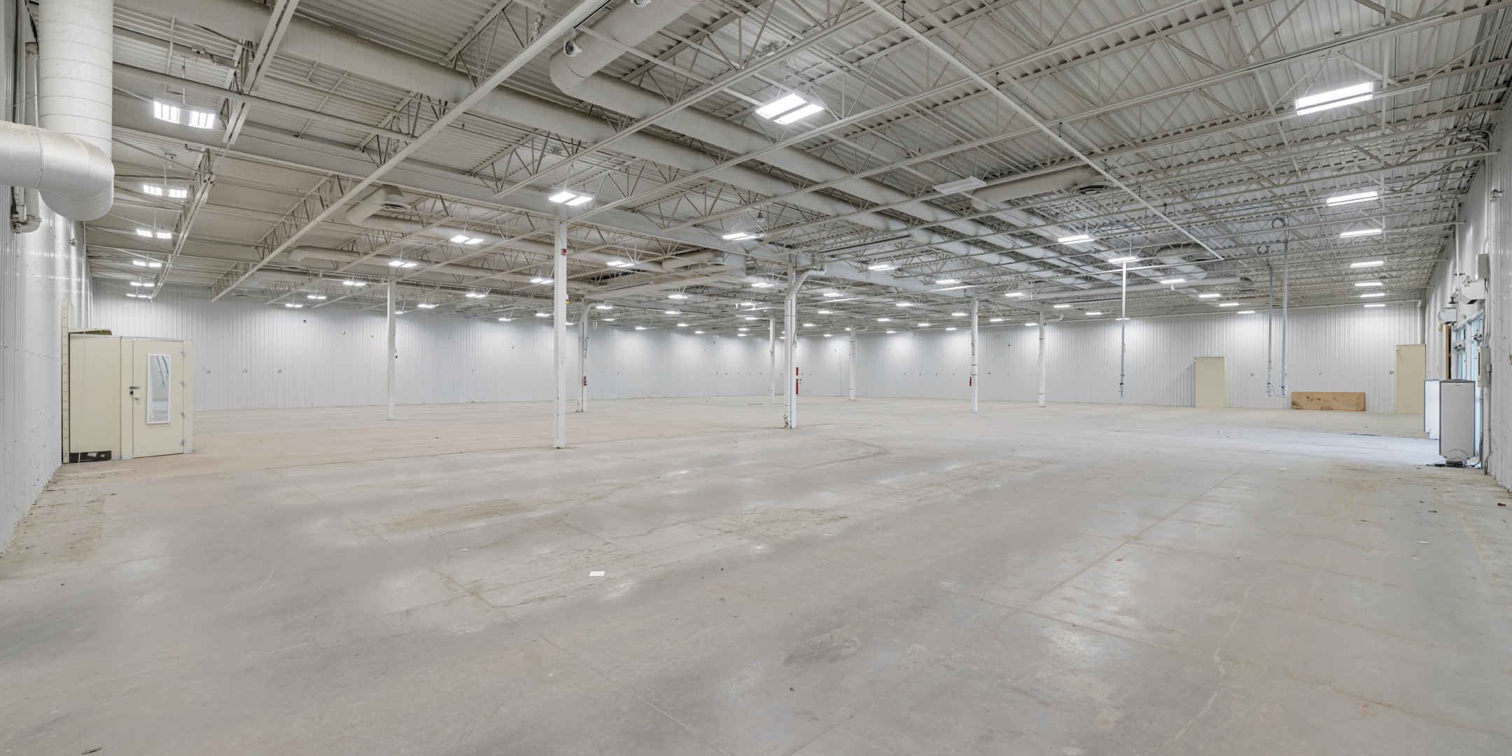 787 St. Clair Street, Chatham - Interior Warehouse Area with concrete flooring and bright lights