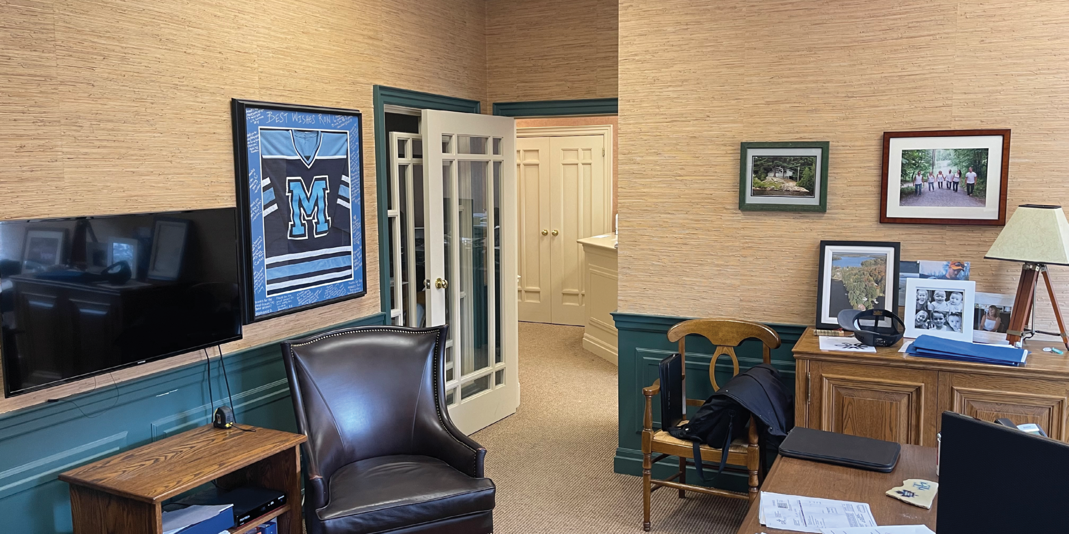 8312 McCowan Road Office Area with TV, Chair, Table and Photo frames