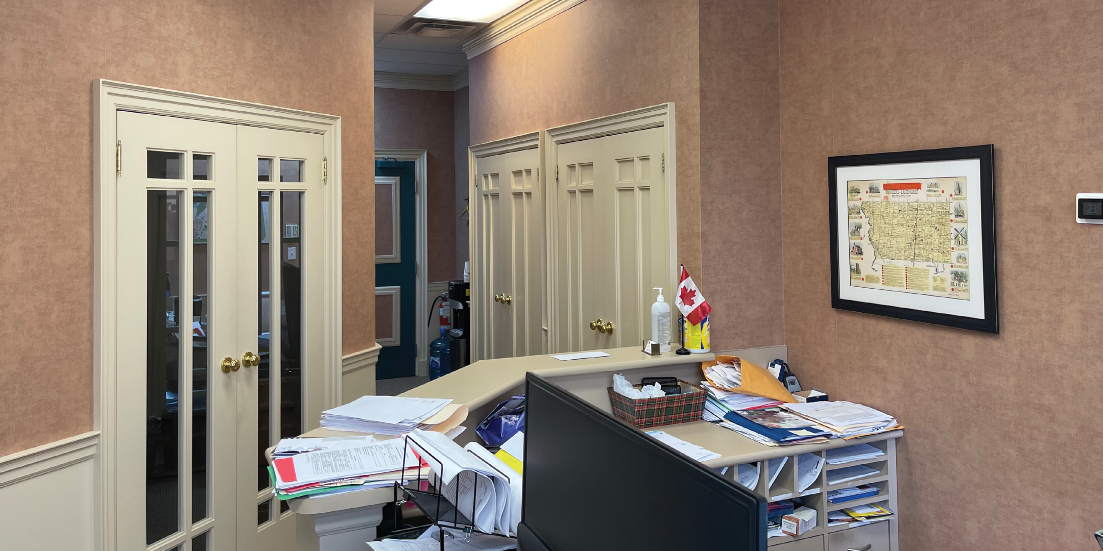 8312 McCowan Road Corridor area with Office doors and desk