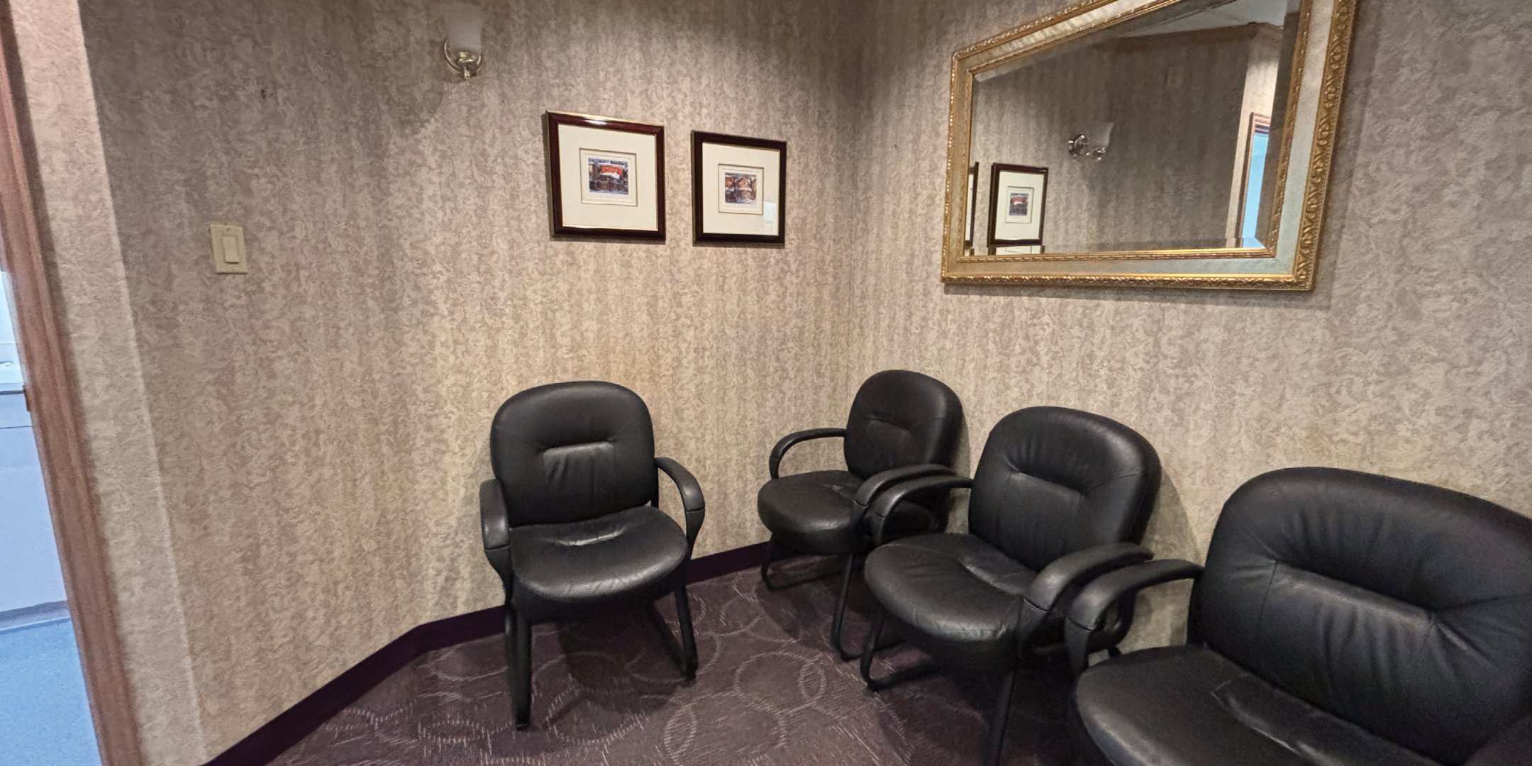 9249 Kennedy Road Medical Office Space Waiting Area with Chairs, Mirror and photo frames on the wall