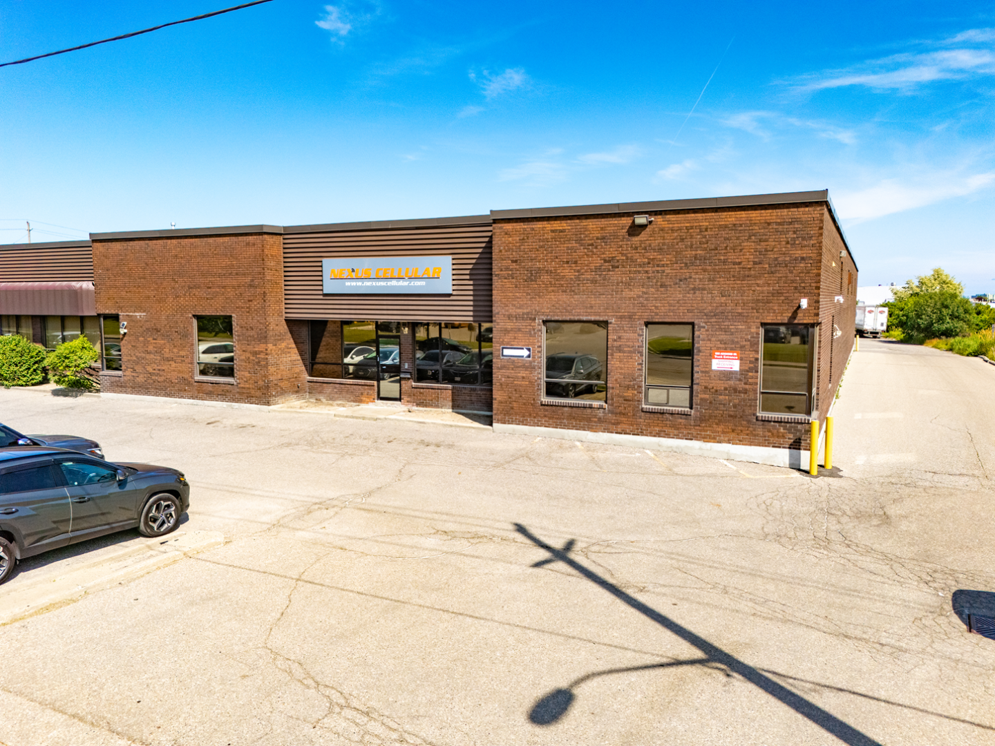 1090 Aerowood Drive front view of red brick single storey building 