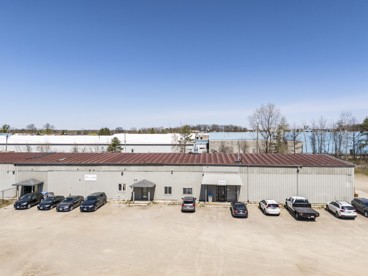 1 Firestone Road front of single storey building with parking  