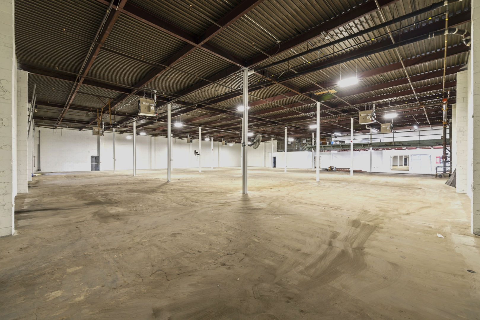 2562 Stanfield Road empty warehouse with white brick walls 