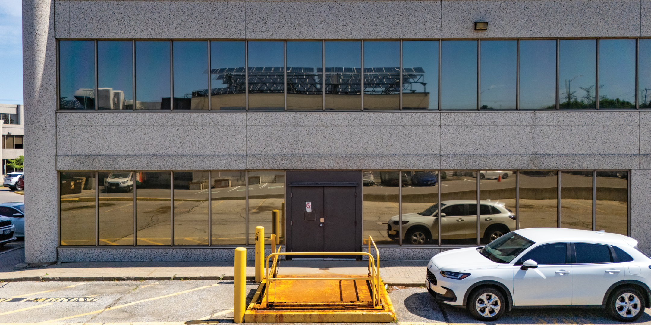 photo of office building at back showing shipping area