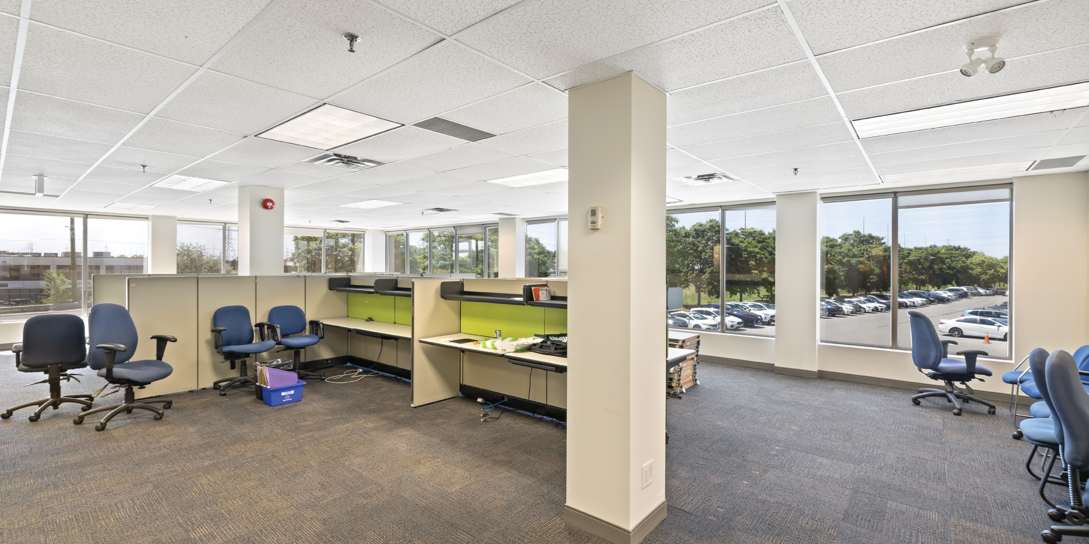 open space with cubicles looking to window outside