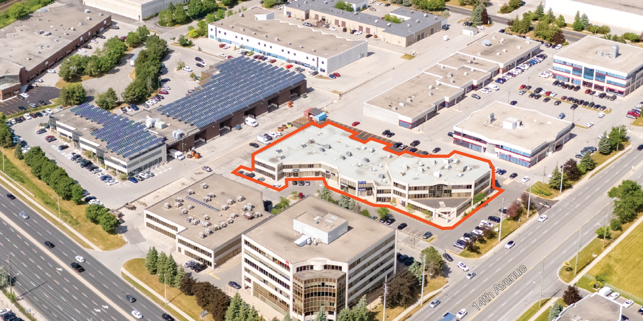 Aerial of mixed use office and industrial building in built up business park