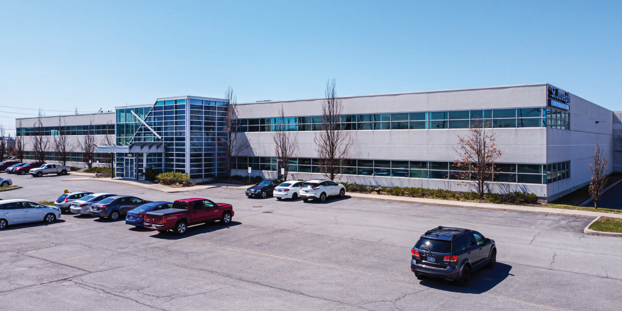 1165 Kenaston Office/Industrial Building Exterior with large parking lot