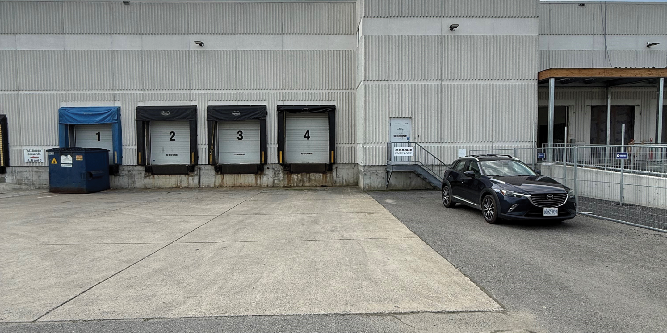 1165 Kenaston Office/Industrial Building Exterior Rear with 4 Shipping Doors