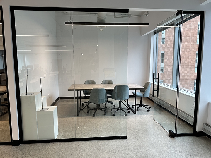 1835 Yonge Street glass-walled conference room with a table and chairs