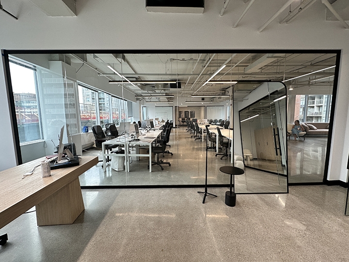  1835 Yonge Street interior view of private office with large mirror leaning against a glass partition