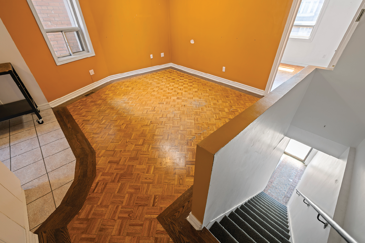 338 Kingston Road interior vacant room with orange painted walls