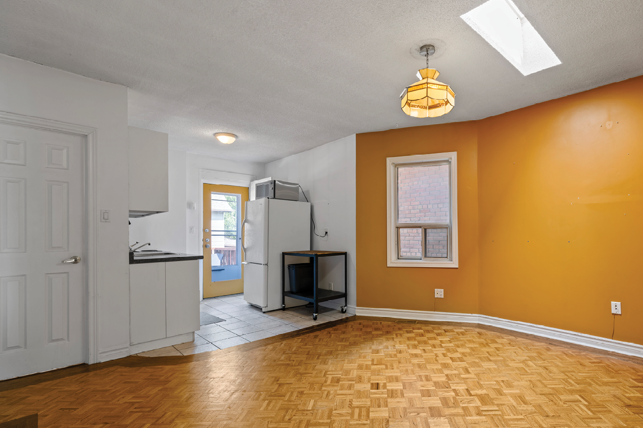 338 Kingston Road interior vacant room with orange painted walls