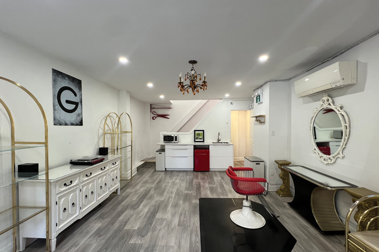 17 Stephanie Street interior with kitchen and red salon chair