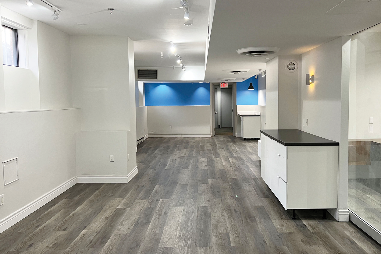 191 John Street long view of open space with modern lighting and laminate flooring