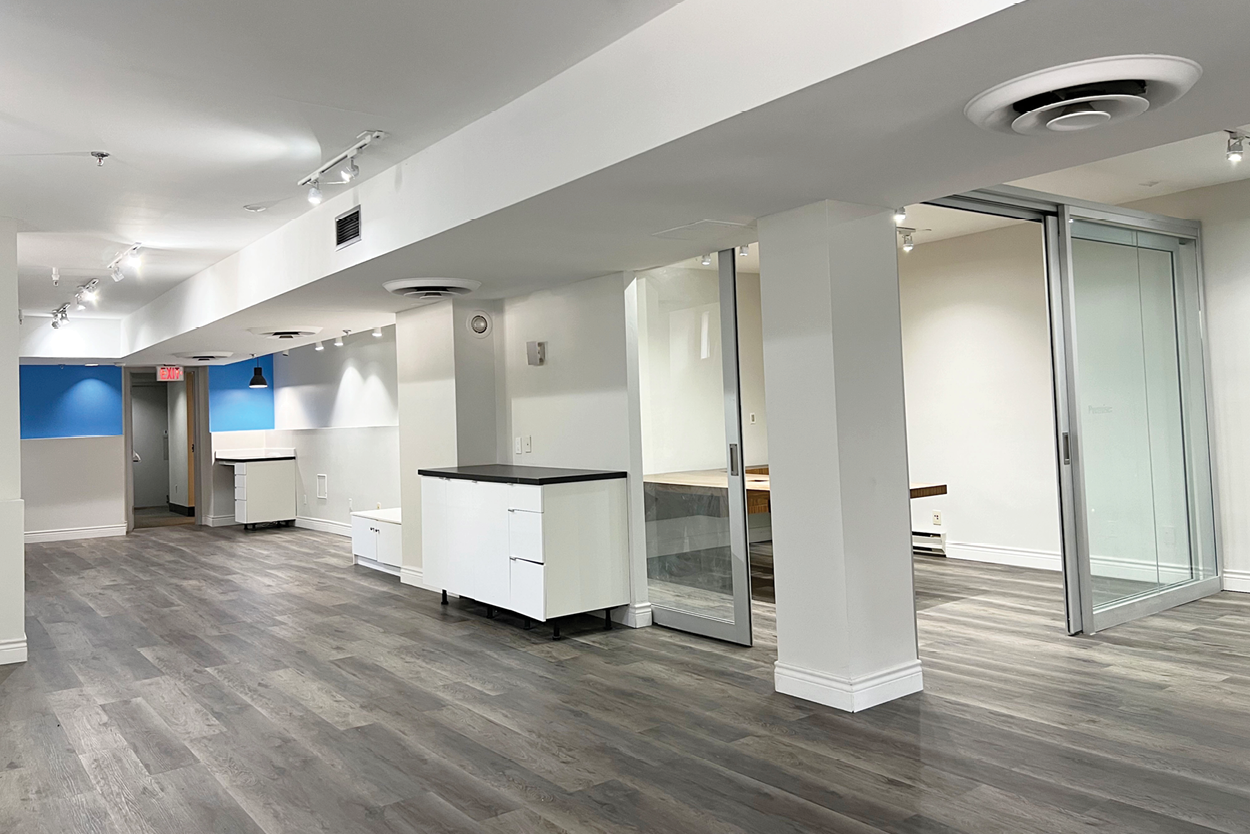 191 John Street open-concept interior with glass-walled boardroom