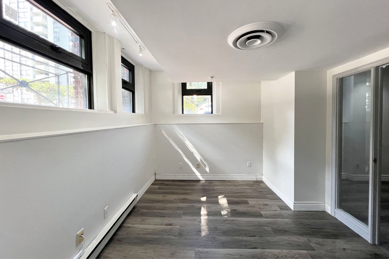 191 John Street narrow room with windows and sunlight streaming in