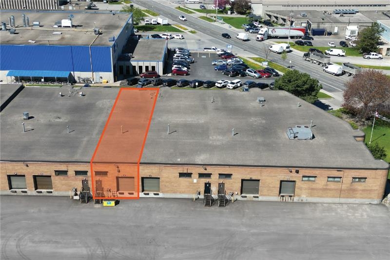 225 Nugget Avenue aerial back view of one storey brick building with one shipping door and orange outline of the available unit 3