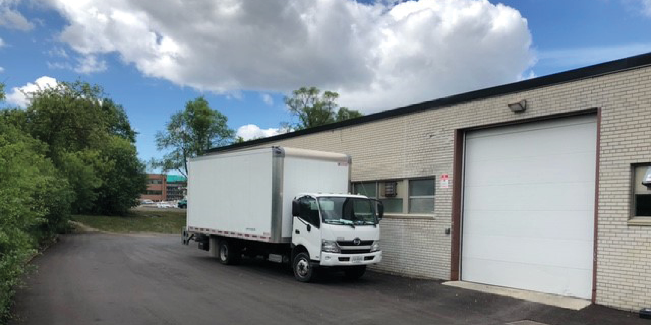 55 Gervais Drive Drive In Door with Shipping Truck