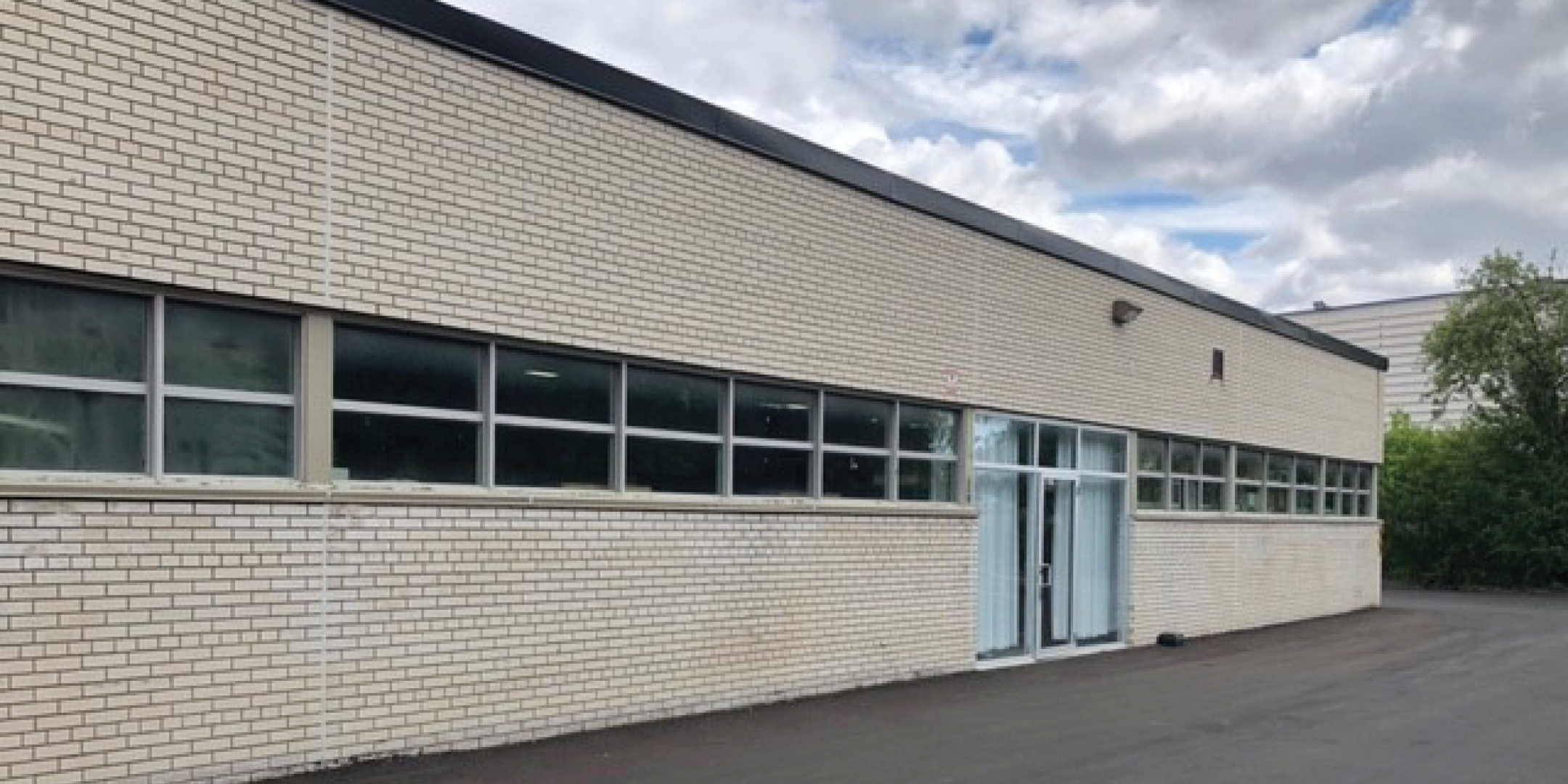 55 Gervais Drive Exterior with side doors and windows
