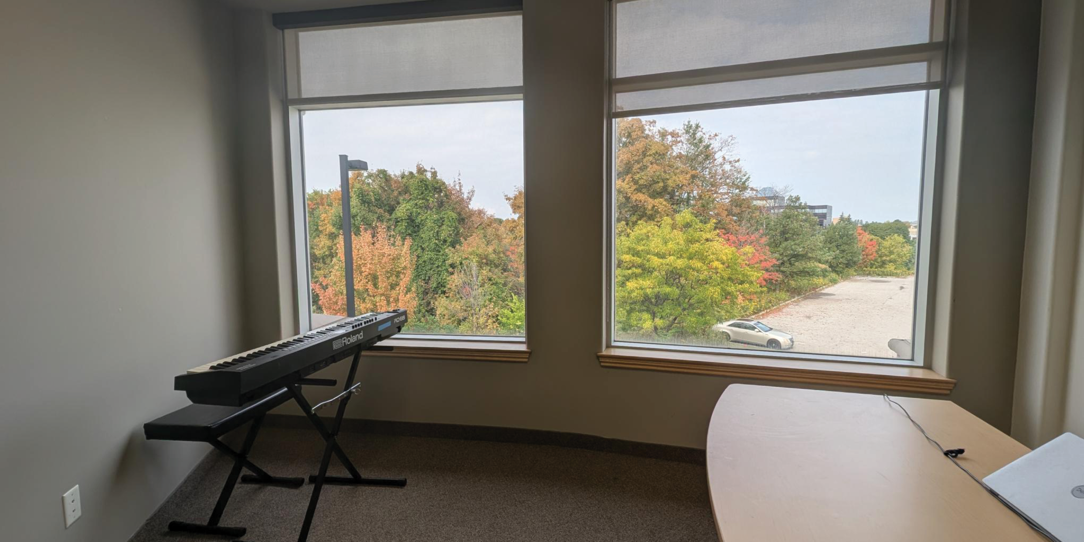 1250 Markham Road Office with two large windows and desk 