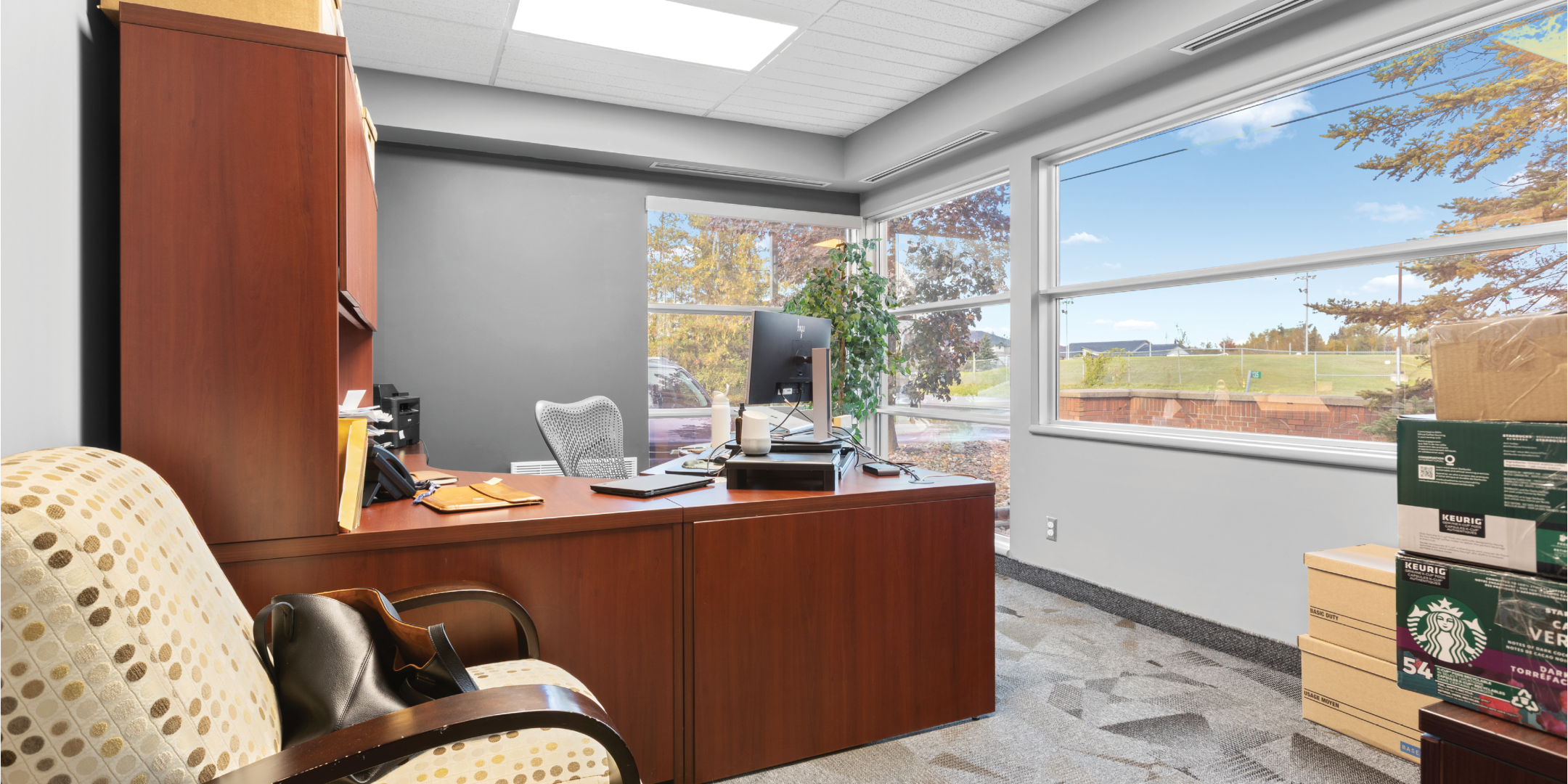 Office with desk and window view