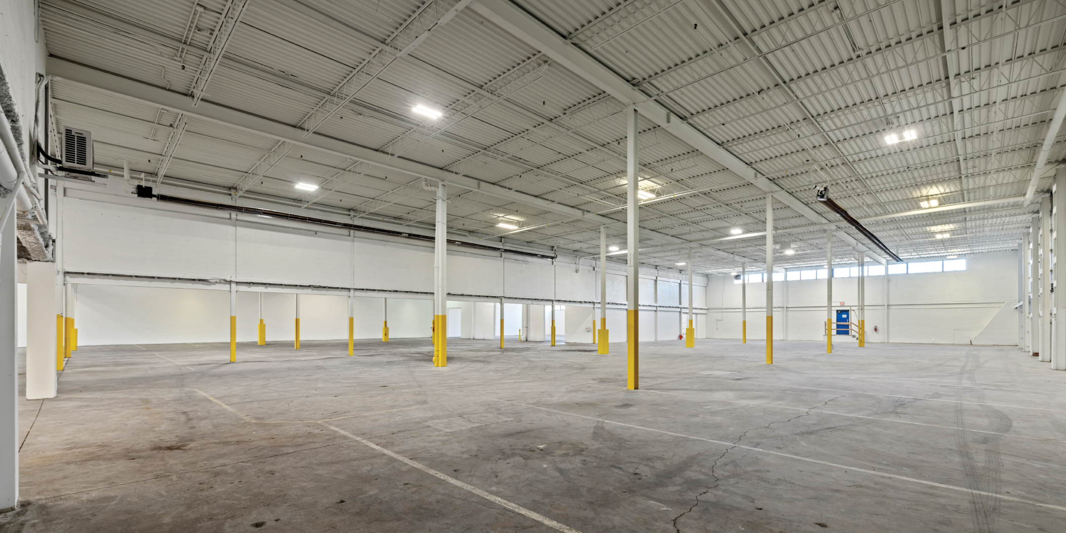 3636 Weston Road interior empty warehouse with concrete floors and painted white walls 